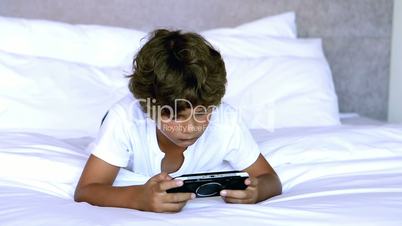 Child lying on bed