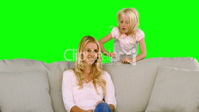 Little blonde girl surprising her mother in slow motion