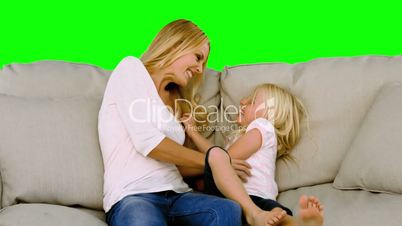 Mother tickling her daughter in slow motion