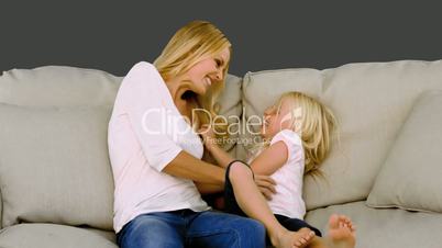 Mother having fun with her daughter in slow motion