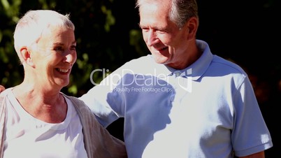 Mature couple walking in a park