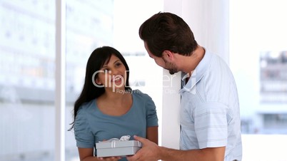 Man offering a present to his girlfriend