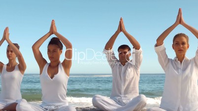 Yoga class on the beach