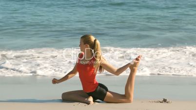 Pretty woman working out on the beach