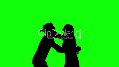 Silhouettes of couple meeting again on green screen