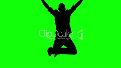 Silhouette of a man jumping and raising arms on green screen
