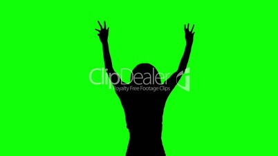 Silhouette of a woman jumping on green screen