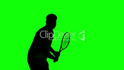 Silhouette of a man playing tennis on green screen