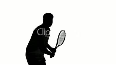 Silhouette of a man playing tennis on white background