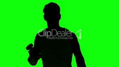 Silhouette of a man lifting dumbbells on green screen