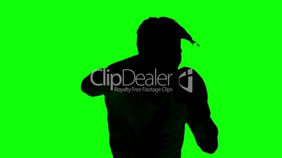 Silhouette of a man boxing on green screen