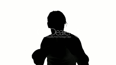 Silhouette of a man boxing on white background