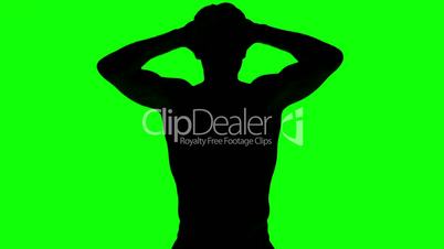 Silhouette of a man tensing arms on green screen