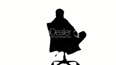 Silhouette of man turning of swivel chair on white background