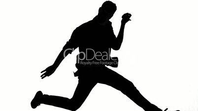 Silhouette of man jumping and gesturing on white background