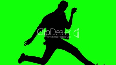 Silhouette of man jumping and gesturing on green screen