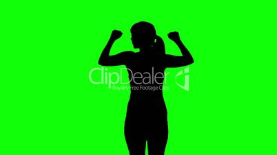 Silhouette of woman stretching arms on green screen