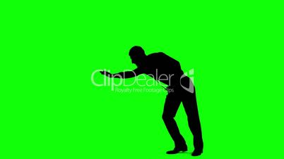 Silhouette of man with a tie breakdancing on green screen