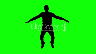 Silhouette of man jumping with legs raised on green screen