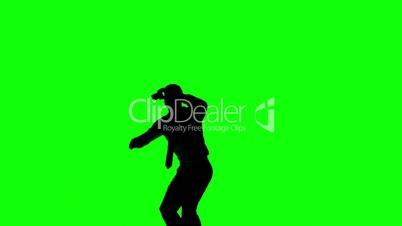 Silhouette of a jumping man turning on green screen
