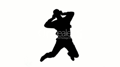 Silhouette of a man jumping and listening to music on white background