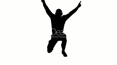 Silhouette of a man enjoying music and jumping on white background