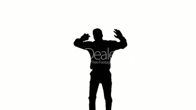Silhouette of a man jumping and raising legs on white background