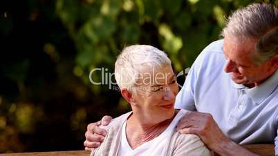 Elderly couple on a park bench