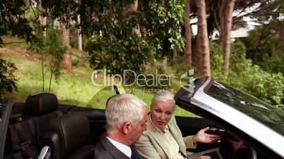 Couple in a silver car