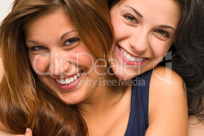 Close up portrait of beautiful girls hugging