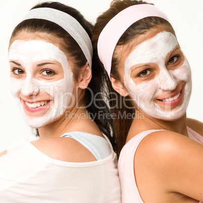 Happy caucasian girls wearing facial mask