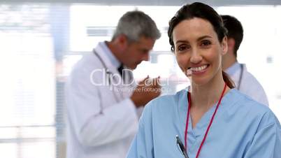 Smiling nurse holding clipboard