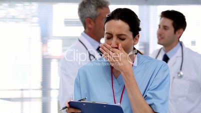 Tired nurse with clipboard