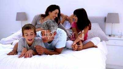 Family speaking on the bed