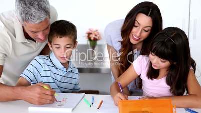 Children colouring with their parents