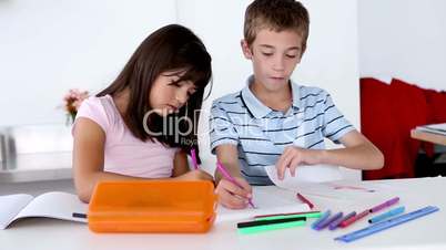 Two children colouring together