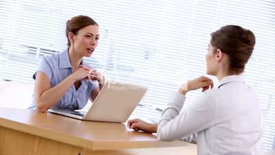 Businesswoman interviewing woman