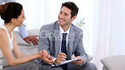 Couple discussing with a salesman