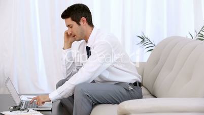 Businessman typing on laptop