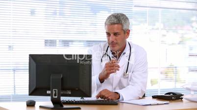 Doctor using his computer