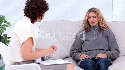 Therapist talking to patient
