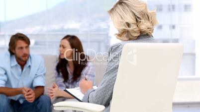 Couple therapist listening to her patients