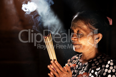 Praying with incense sticks