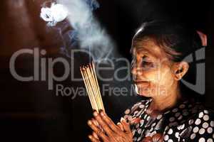 Praying with incense sticks
