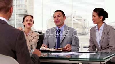 Business people laughing during a job interview