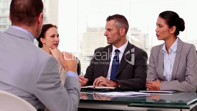Business people listening to a job applicant
