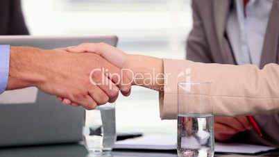 Close up of business people shaking hands