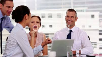 Cheerful business people working together in their office