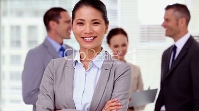 Businesswoman laughing and looking at camera