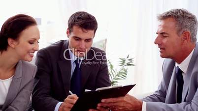 Businessman giving business people a contract